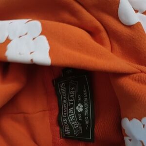 Denim Tears Orange Hoodie with White Print